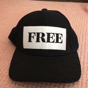 SnapBack Black hat that says “FREE” on the front.